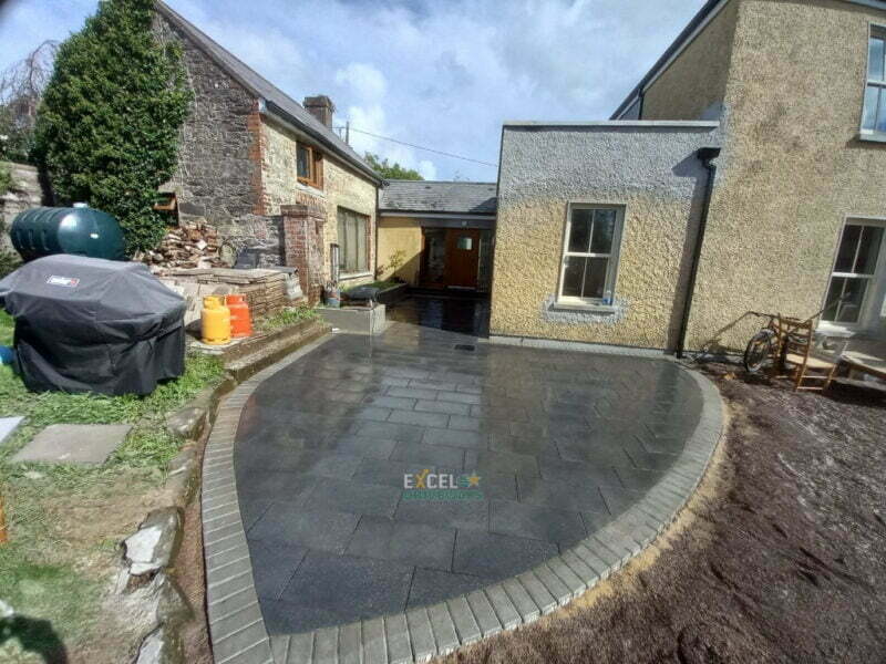 Black Granite Patio Area with Natural Paved Border in Carrignavar, Co. Cork