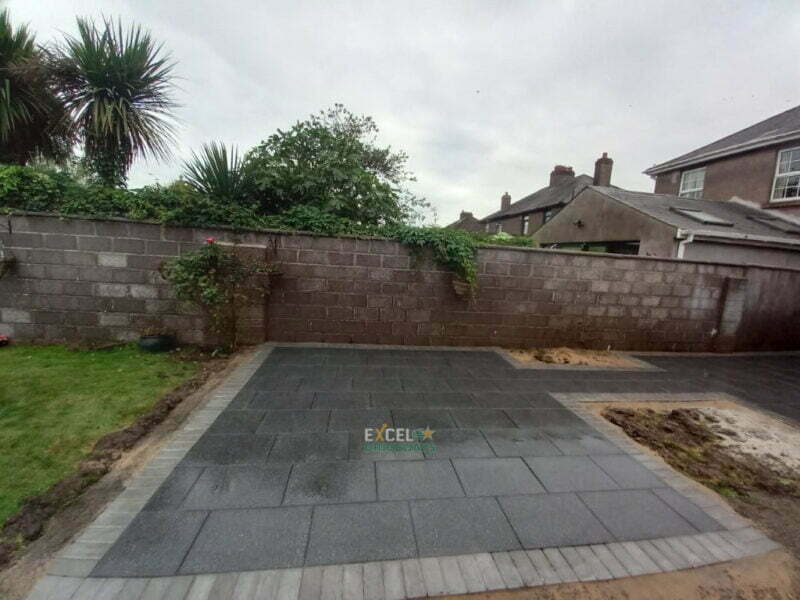 Black Granite Slabbed Patio with Paved Border in Ballinlough, Cork City