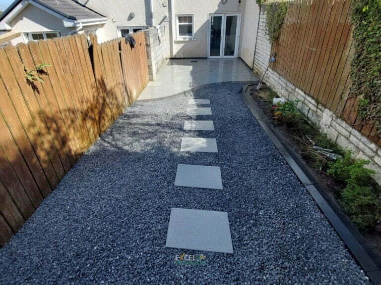 Patio with Silver Granite Slabs and Limestone Gravel in Passage West