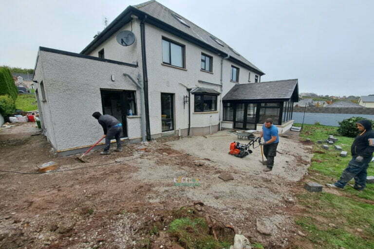 Patio with Silver Granite Slabs, Charcoal Border and Connemara Walling