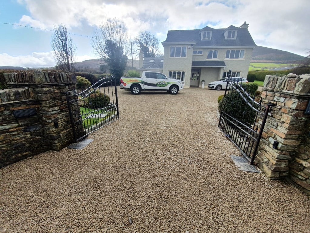 Golden Gravel Driveway with Sandstone Patio in Milstreet Excel